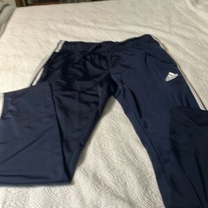 Adidas track pants.